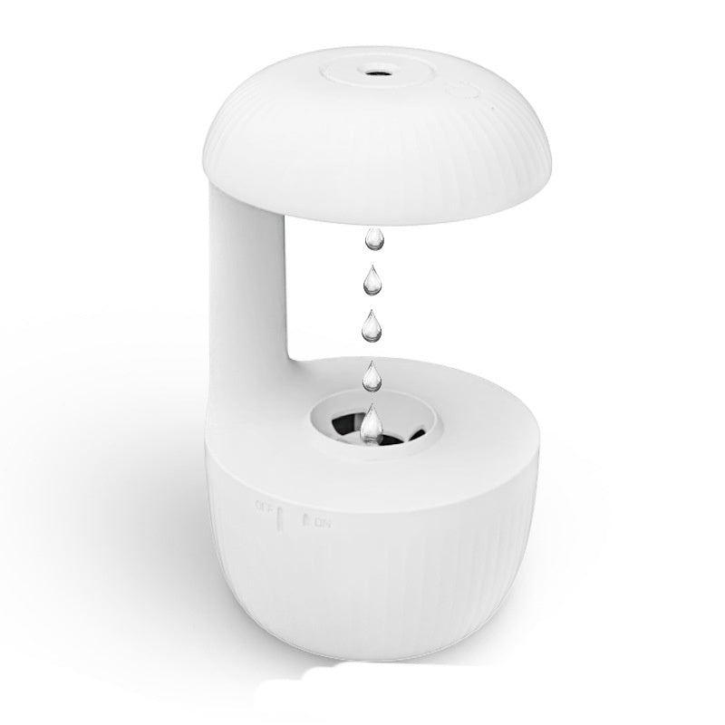 White ceramic water fountain with water droplets on a white background